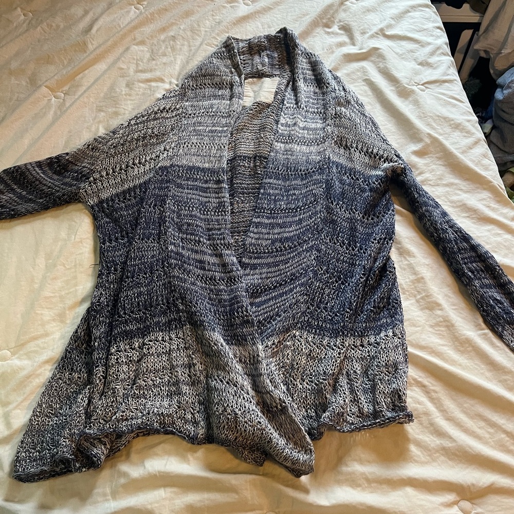 Beautiful blue light cardigan. Good shape , no holes no rips . Non smoking home